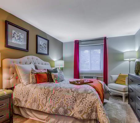 A cozy private resident room with a queen bed