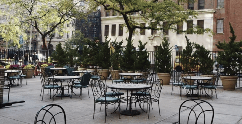 Outdoor dining area with tables and chairs