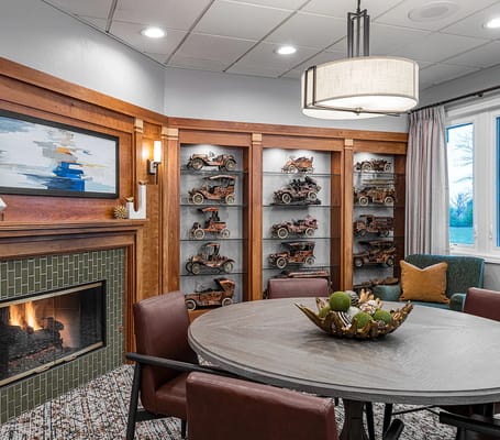 A cozy interior common area with model cars displayed