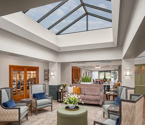Interior common area with modern seating and skylight