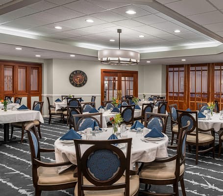 Elegant dining room with tables set for a meal