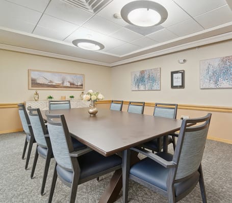 Common area meeting room with a large table and chairs