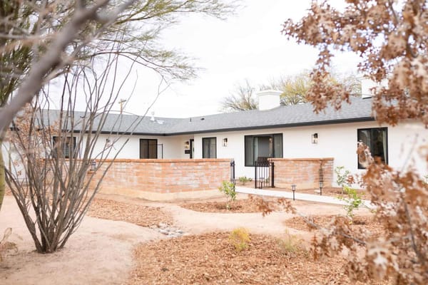 Exterior view of a senior living residence with landscaping