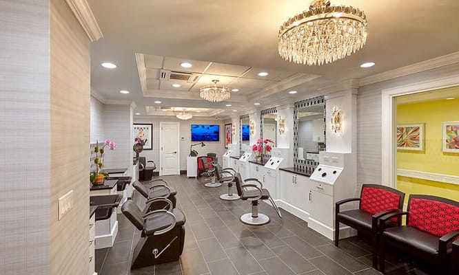Bright, modern beauty salon with hair styling chairs