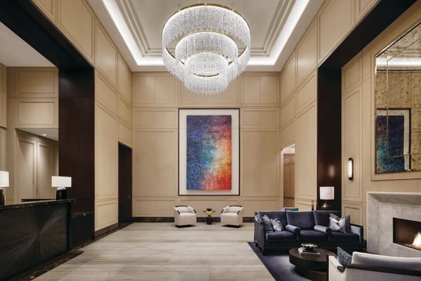 Elegant lobby area with modern decor and chandelier