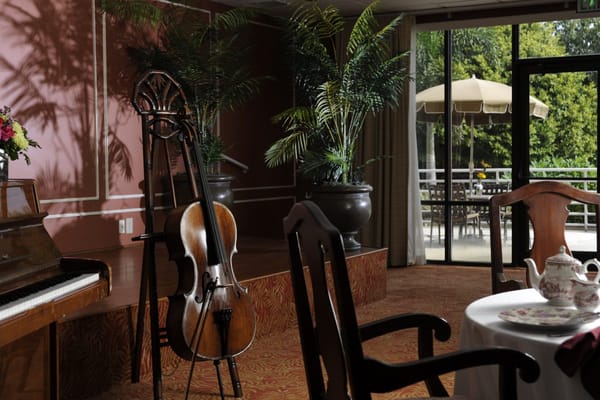Interior common area with piano and greenery