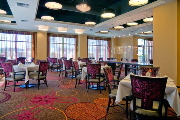 Elegant dining area with tables and chairs set up