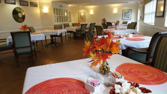 Dining room with fall decorations and empty tables