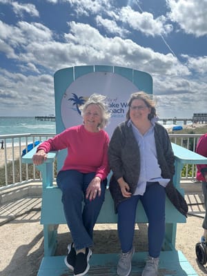 Two women enjoying a sunny day at the beach