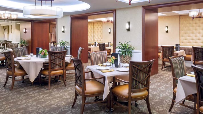 Elegant dining area with round tables and comfortable chairs