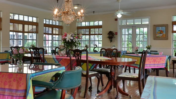 Interior dining room with tables and chandeliers