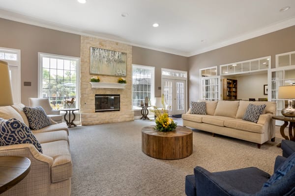 Spacious and inviting living room with comfortable seating and a fireplace