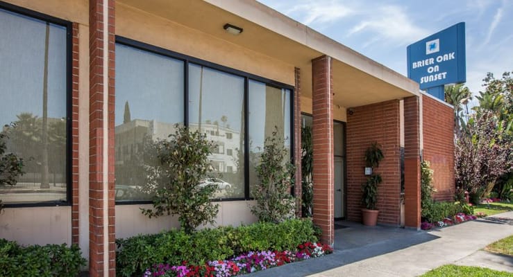 Exterior view of Brier Oak on Sunset with signage