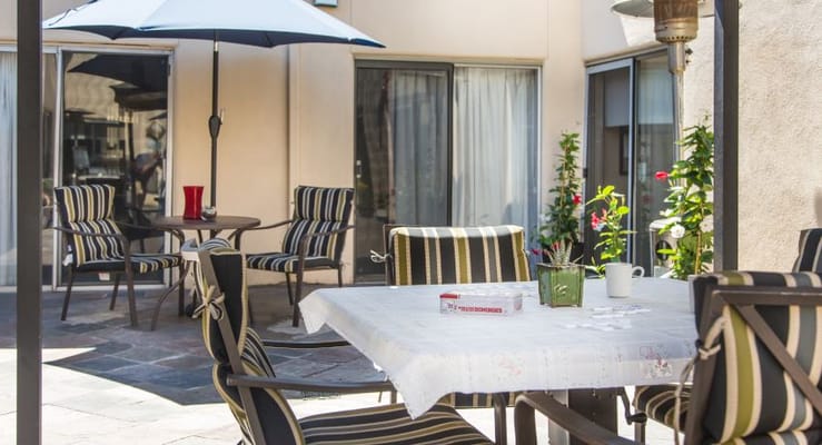 Outdoor seating area with table and chairs