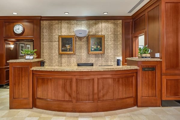 Reception area with wooden decor and artwork