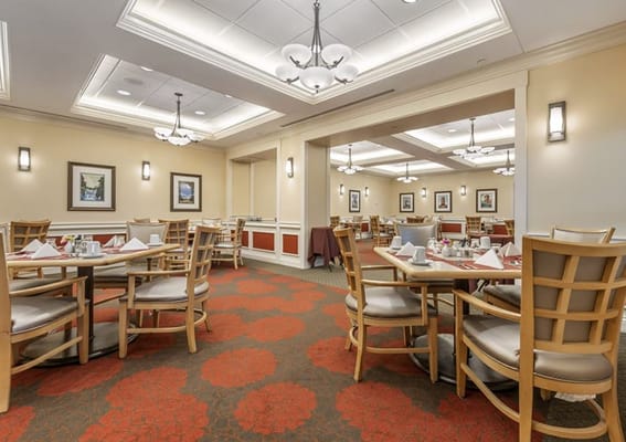 Interior view of a dining room with set tables