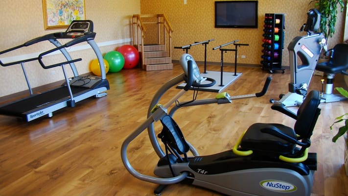 Interior view of a fitness room with exercise equipment