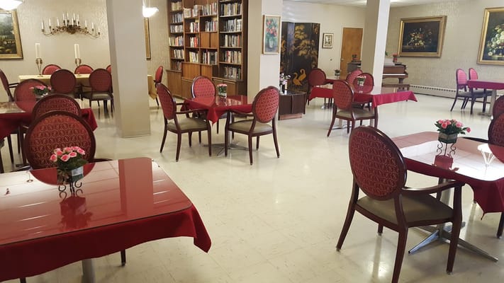 Dining area with red tables and chairs