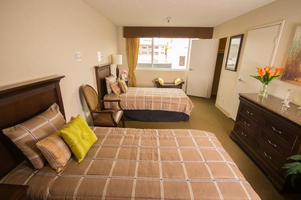 Cozy shared bedroom with two beds and decor