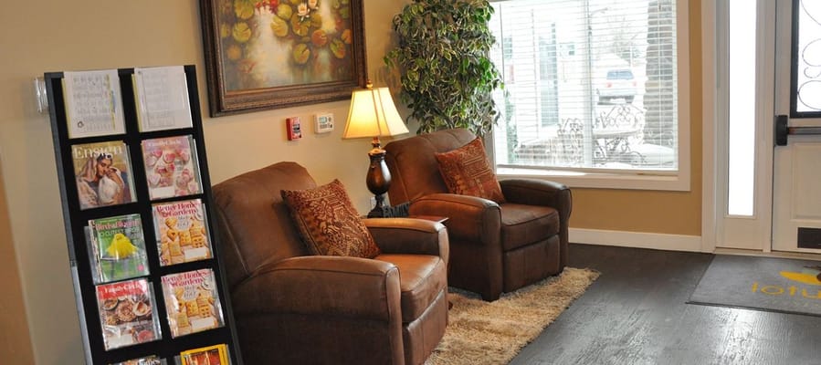 Cozy lobby area with comfortable seating and magazines