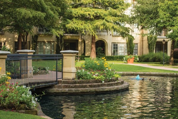Pond with fountain and flowers in Edgemere's courtyard