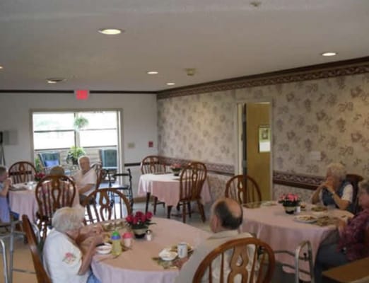 Residents enjoying a meal in a dining area