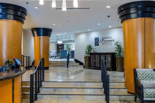 Welcoming lobby with decorative columns and seating area