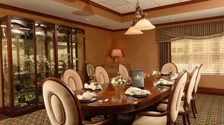 Dining room with a large wooden table set for a meal