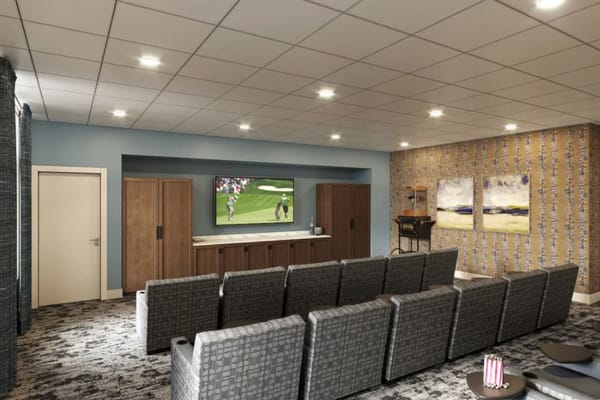 Interior common area with seating and a TV