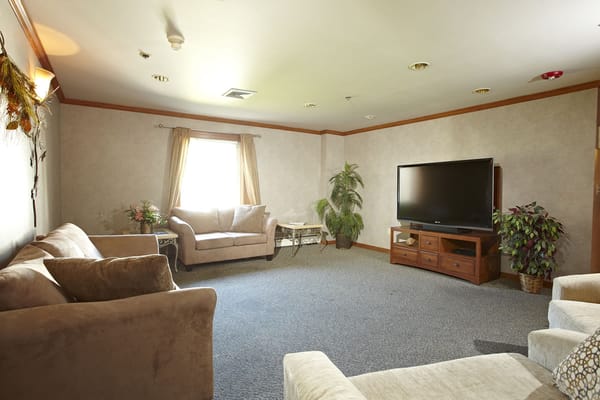 Cozy common area with comfortable seating and a TV