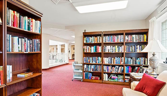 Cozy library with bookshelves and reading space