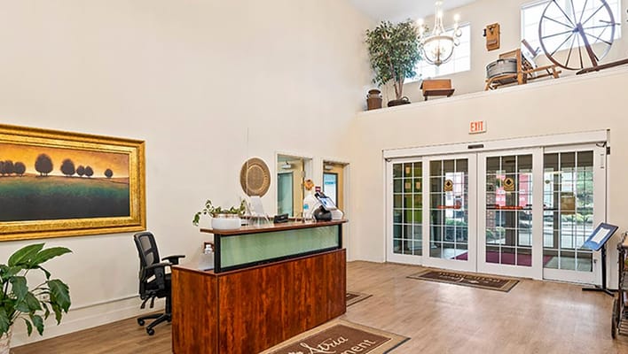 Lobby reception area with seating and decorative artwork