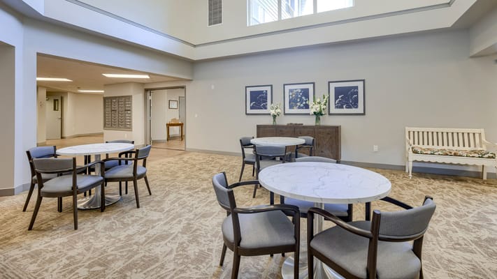 Bright common area with tables and chairs