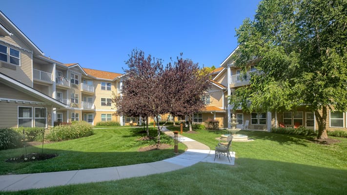 Well-maintained courtyard with trees and walkways