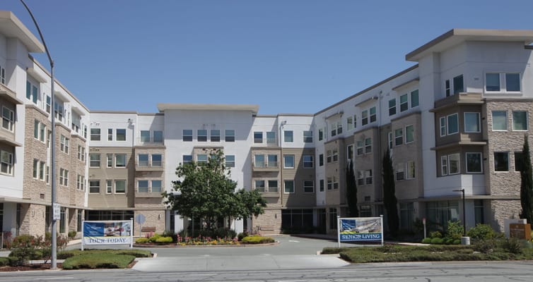 Exterior view of The Watermark at Almaden with signage.