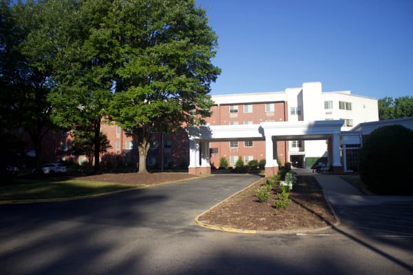 The entrance and exterior of The Barrington at Hioaks senior living facility.