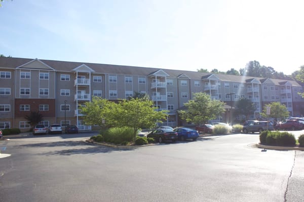 A view of the exterior of The Crossings at Bon Air senior living facility.