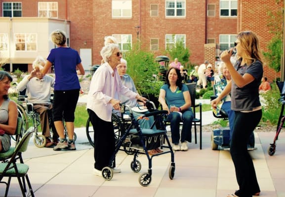 Residents enjoying an outdoor activity in the garden space
