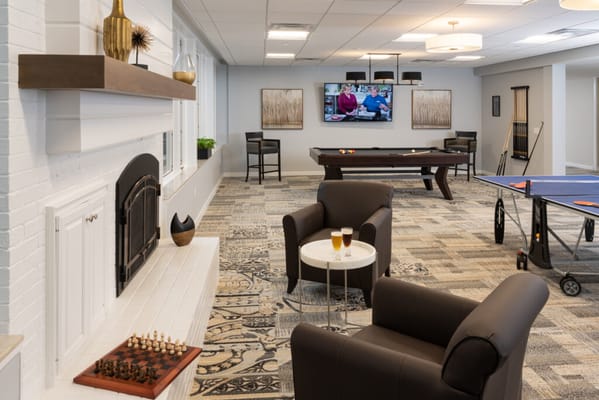 Interior common area with recreational games and seating