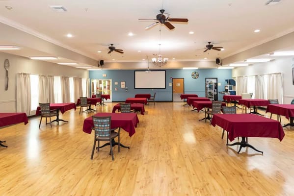 Bright common area with tables and chairs