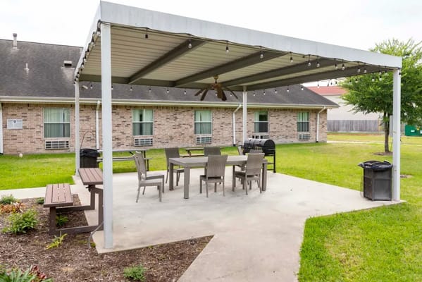 Covered outdoor seating area with dining tables