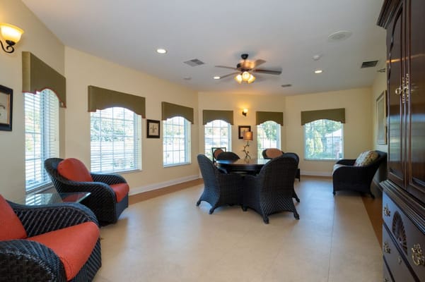 Bright common area with seating and windows