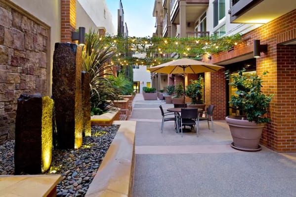 Outdoor courtyard with seating and greenery