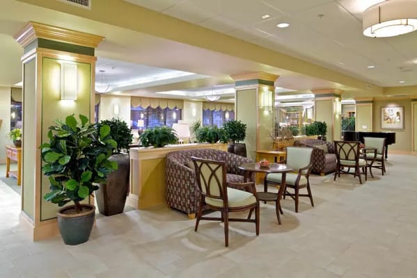 Bright common area with seating and plants