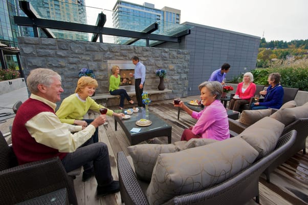 Residents socializing on a chic outdoor patio