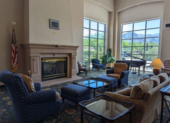 Cozy common area with seating and large windows overlooking mountains