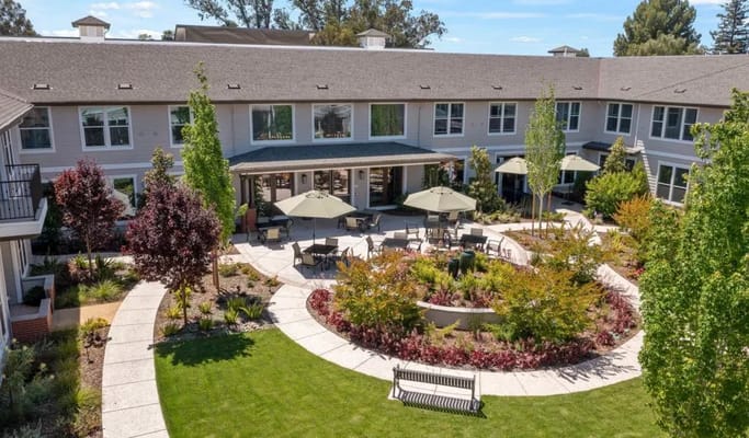 Aerial view of a landscaped outdoor space with seating