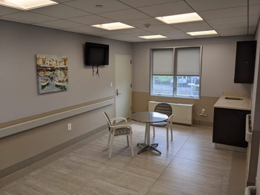 Bright, spacious common area with seating and artwork