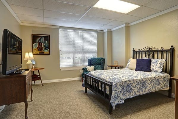 Cozy resident room with a bed and television