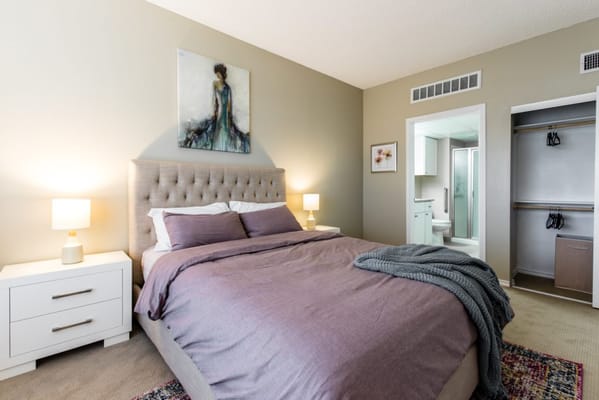 Cozy resident bedroom with warm lighting and decor